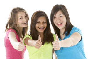 teenage girls with thumbs up