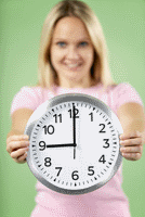 woman holding clock