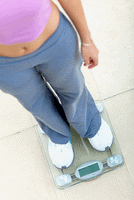 woman standing on scale
