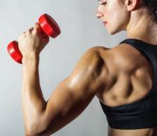 woman lifting dumbbell