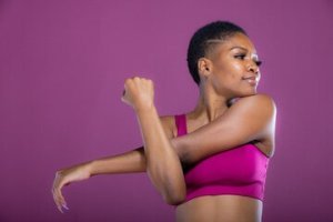 woman stretching arm