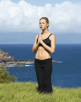 woman meditating in open field