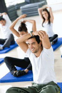 group of people doing stretching exercises