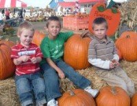 cute kids in pumpkin patch
