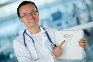 nutritionist holding weight scale