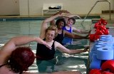 senior women doing water aerobics