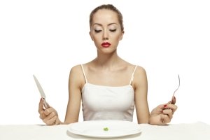 woman eating tomato